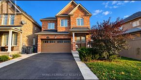 Brampton (Sandringham-Wellington) apartment for rent - A large brick house with a driveway in front.