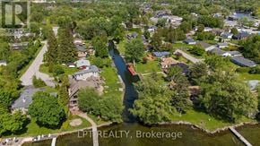 Georgina (Keswick North) duplex for rent - A bird's eye view of a residential area with a river running through it.