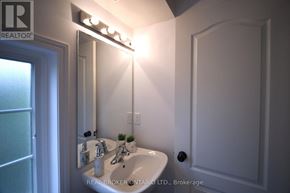 Mississauga (Lakeview) townhouse for rent - A bathroom with a sink, mirror, and lights.