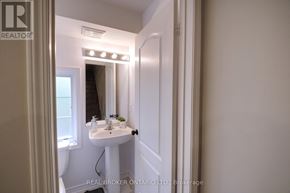 Mississauga (Lakeview) townhouse for rent - A bathroom with a sink, mirror, and lights.