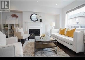 Mississauga (Meadowvale Village) townhouse for rent - A living room with a fireplace and a couch.