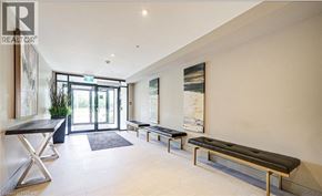 Milton condo for rent - A modern living room with a bench and a table.