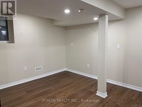 Oakville (Jc Joshua Creek) apartment for rent - A room with wooden flooring and a white pillar in the middle.