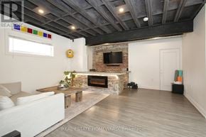 Toronto (South Riverdale) apartment for rent - A living room with a fireplace and a couch.