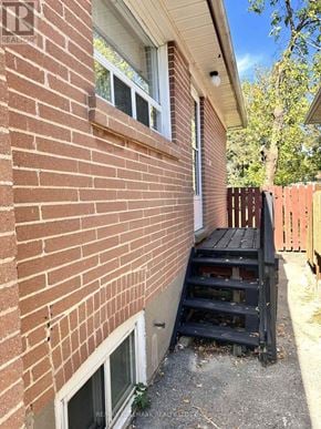 Richmond Hill (Crosby) apartment for rent - A red brick house with a window and a wooden pallet.