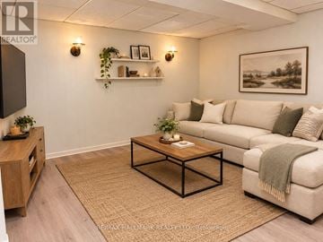Richmond Hill (Crosby) apartment for rent - A living room with a couch, coffee table, and a painting on the wall.