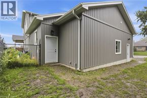 St. Agatha apartment for rent - A grey house with a white door is for sale.