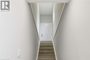 St. Agatha apartment for rent - A stairway leading to a white door.