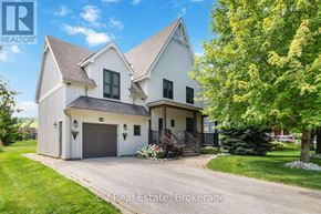 Blue Mountains apartment for rent - A white two-story house with a garage and a tree in front.