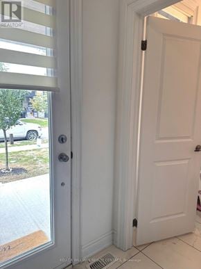 Wasaga Beach townhouse for rent - A white door with a window above it.