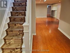 Brampton (Fletcher's Meadow) apartment for rent - A staircase with a floral patterned runner and wooden steps.