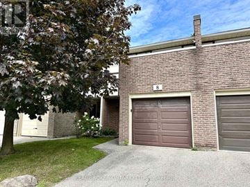 Mississauga (Applewood) townhouse for rent - A house with a brown garage door is for sale.