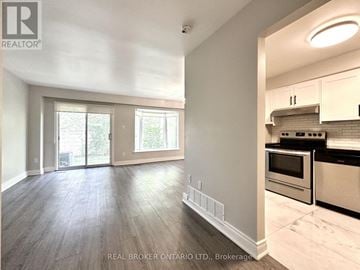 Mississauga (Applewood) townhouse for rent - A kitchen with a stove top oven and a microwave.