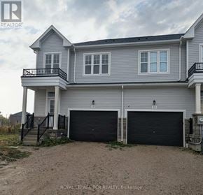 Southgate townhouse for rent - A two-story house with a garage is for sale.