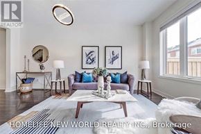 Whitchurch-Stouffville (Stouffville) townhouse for rent - A living room with a white couch and a coffee table in front of it.