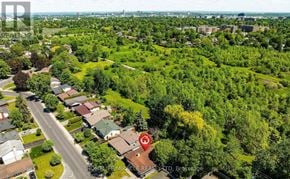 Ottawa apartment for rent - A bird's eye view of a residential area with houses surrounded by greenery.