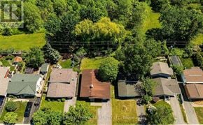 Ottawa apartment for rent - A bird's eye view of a residential area with houses and greenery.