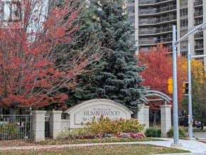 Toronto (West Humber-Clairville) condo for rent - The entrance to The Meadows of Humberwood is framed by trees with red leaves.