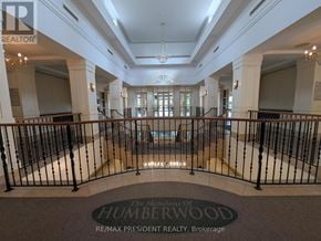 Toronto (West Humber-Clairville) condo for rent - The lobby of a building with a sign that reads "The Mansions of Humberwood".