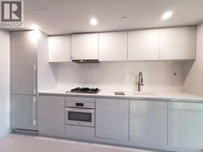 Vancouver apartment for rent - A white kitchen with a stove, oven, and sink.
