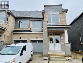 Brampton (Northwest Brampton) townhouse for rent - A white van is parked in front of a two-story house.