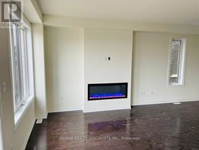 Brampton (Northwest Brampton) townhouse for rent - A room with a fireplace and a window.
