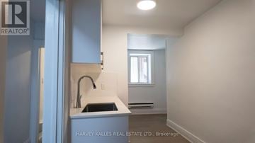 Toronto (Forest Hill South) house for rent - A kitchen area with a sink and a window.