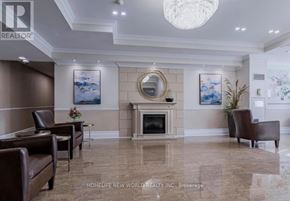 Richmond Hill (North Richvale) condo for rent - A living room with a fireplace and a painting on the wall.