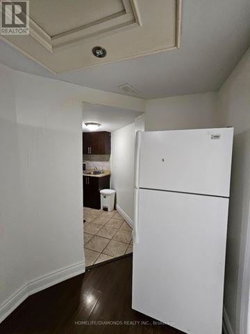 Brampton (Northwest Sandalwood Parkway) apartment for rent - A white refrigerator in a kitchen with a white wall.