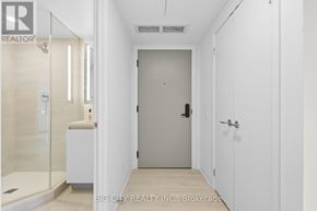 Toronto (Leaside) condo for rent - A white hallway with a door at the end.