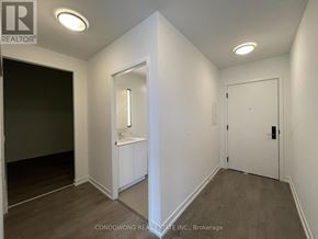 Toronto (South Parkdale) condo for rent - A white bathroom with a sink and mirror.