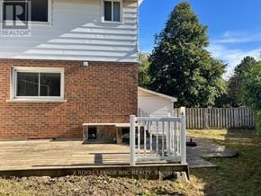 Niagara Falls (Morrison) apartment for rent - A house with a white fence and a deck in front.