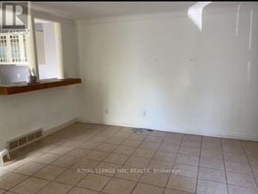 Niagara Falls (Morrison) apartment for rent - A room with white walls and a window with a view of a building outside.