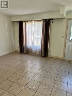 Niagara Falls (Morrison) apartment for rent - A room with a sliding door and curtains.