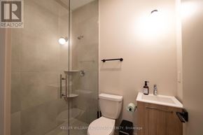 Toronto (Kensington-Chinatown) apartment for rent - A bathroom with a toilet, sink, and shower.