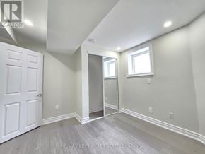 Whitby (Williamsburg) apartment for rent - A room with a white door and a window.