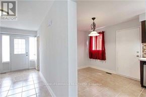 Brampton (Brampton North) apartment for rent - A room with a white door and a red curtain.