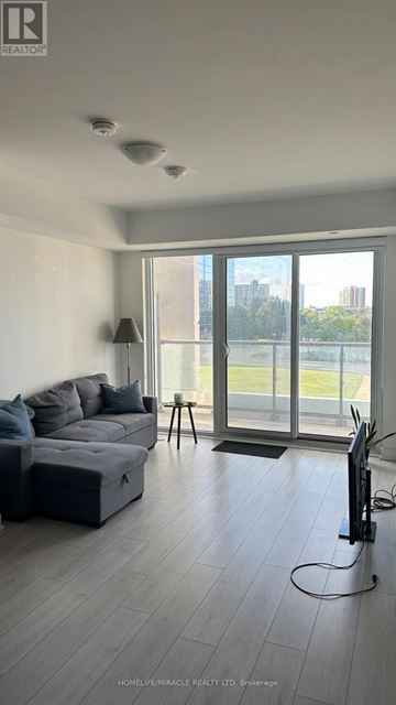 Toronto (Agincourt South-Malvern West) condo for rent - A living room with a grey couch and a television.
