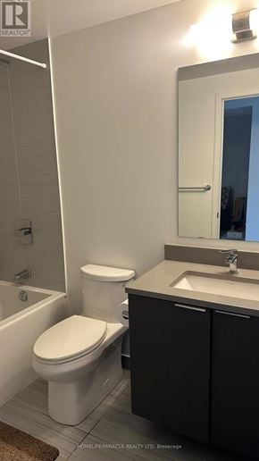 Toronto (Agincourt South-Malvern West) condo for rent - A white toilet sits next to a sink in a bathroom.