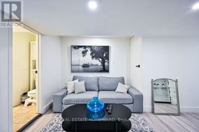 Toronto (South Riverdale) apartment for rent - A living room with a grey couch and a painting on the wall.