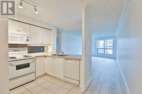 Toronto (Mimico) condo for rent - A kitchen with white appliances and cabinets is on the market with Bosley Real Estate LTD.