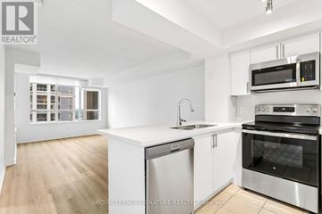 Mississauga (City Centre) condo for rent - A white kitchen with a sink and stove.