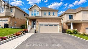 Waterloo apartment for rent - A house with a garage and a driveway in front of it.