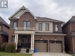 Niagara Falls (Brown) apartment for rent - A two-story house with a balcony and a garage.