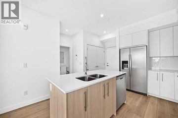 Calgary apartment for rent - A modern kitchen with wooden cabinets and stainless steel appliances.