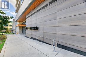 Toronto (Annex) condo for rent - A modern building with a sign that reads "REALTOR" on the side.