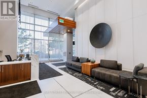 Toronto (Annex) condo for rent - A realtor's office with a reception desk and a couch.