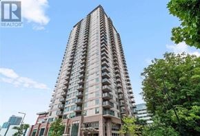 Toronto (Bendale) condo for rent - A tall residential building with balconies on each floor.