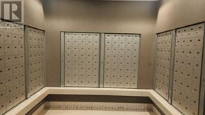 Toronto (Bendale) condo for rent - A wall of lockers with a sign that says RE/MAX Realty Services Inc. Brokerage.