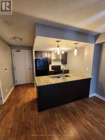 Toronto (Bendale) condo for rent - A kitchen with a sink and a refrigerator.